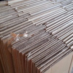 flattened corrugated boxes prepared for cardboard recycling near me