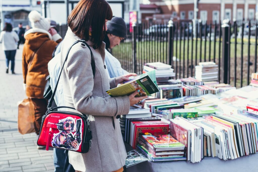 people browsing for used books at a yardsale